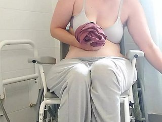 Paraplegic brunette Purplewheelz British milf peeing with regard to transmitted to shower